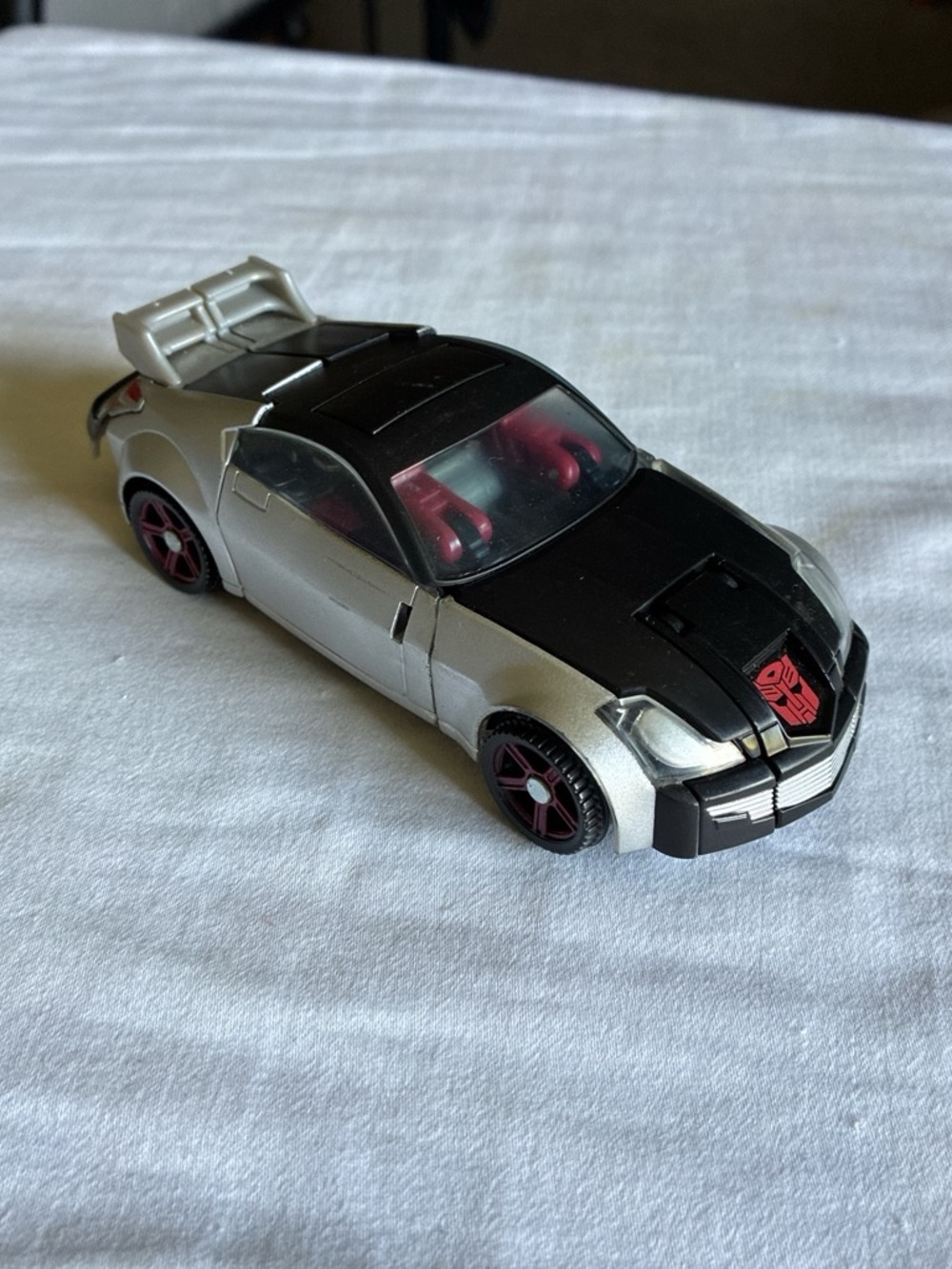 Transformer Silver and Black Sports Convertible Toy Car with Red Accents